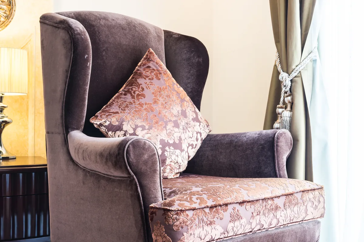 Wingback armchair upholstered in Rumors fabric